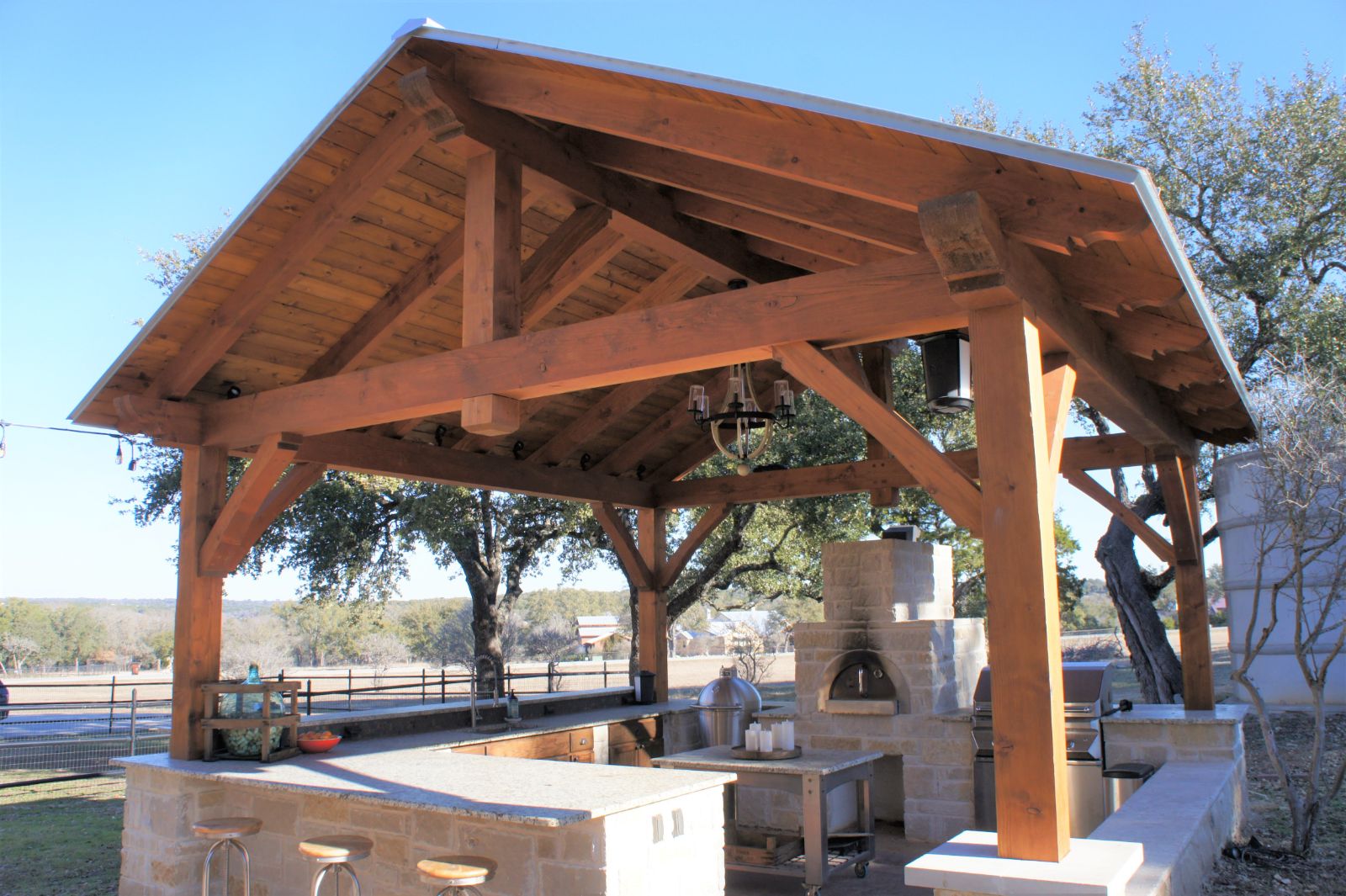 19x19, king post, patio furniture, barbecue or grill, kitchen or outdoor kitchen, firepit or fireplace, residential, garden structure, cabana, outdoor living, entertaining, free standing pavilion, post and beam, builder/contractor, austin