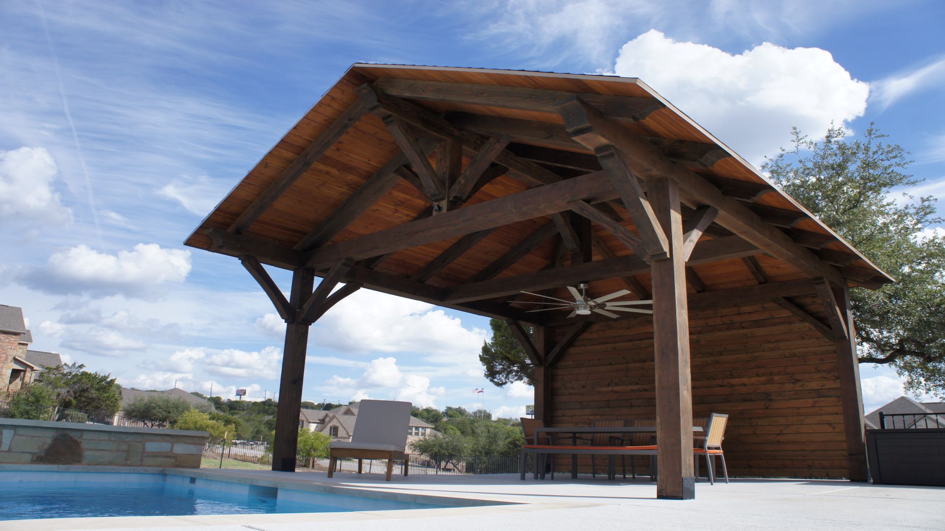 16 x 16, cantilever, half hip, poolside or swimming pool, cabana, entertaining, outdoor living, timber frame pavilion, pavilion with wall, prefab, free standing pavilion, Austin, spicewood, hill country pavilions, heavy timbers