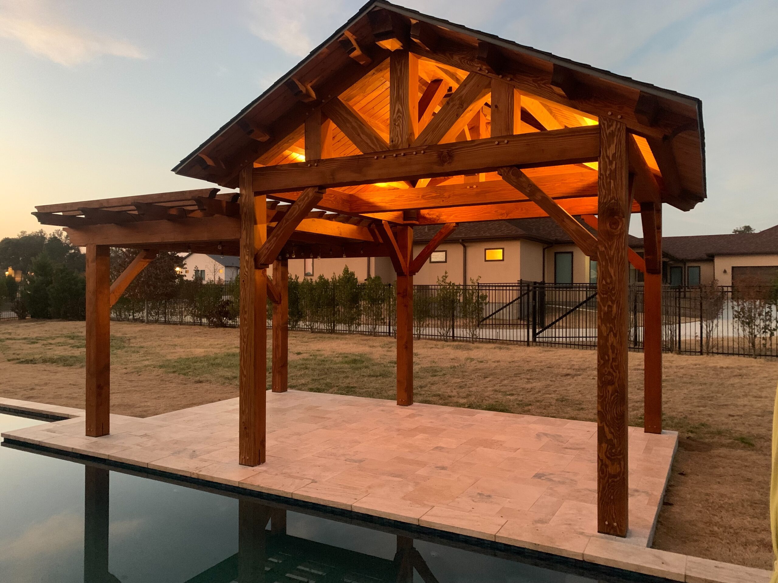 knife blade, Houston, 12' x 12', heavy timbers, shingle roof, douglas fir, queen post half hip, pavilion with pergola, lighting, pavers, free standing pavilion, shade structure, poolside or swimming pool, builder/contractor, covered patio